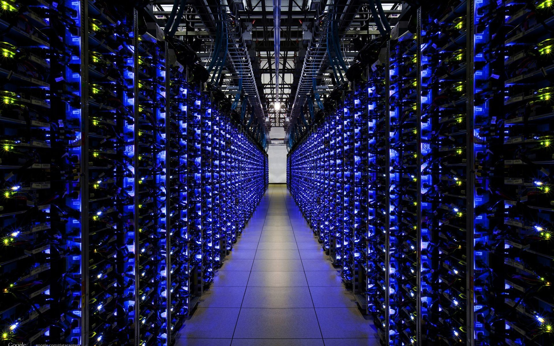 Server room data hall with rows of illuminated network racks